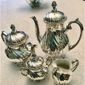 Coffee/tea set. Crafted in Germany WMF silver on porcelain coffee/tea set.